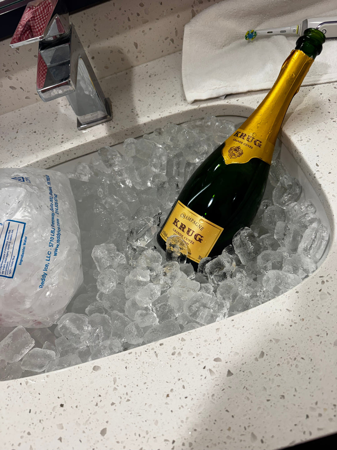 Krug Grande Cuvée chilling in a sink full of ice