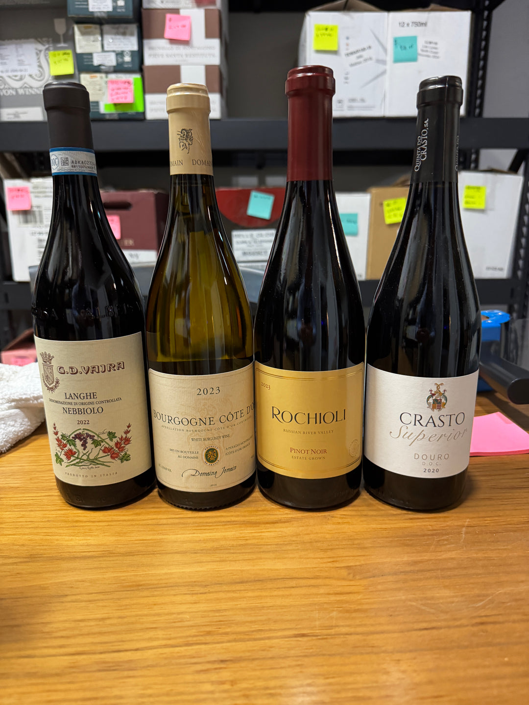A past Munk Mafia Wine Club Mixed bundle with three bottles of red and one bottle of white wine arranged together.