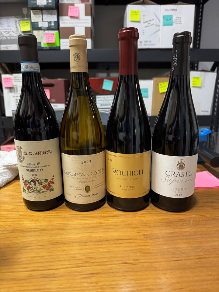 A past Munk Mafia Wine Club Mixed bundle with three bottles of red and one bottle of white wine arranged together.