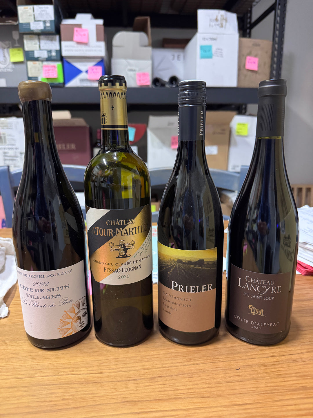 A past Munk Mafia Wine Club Mixed bundle with four bottles of red and white wine arranged together.